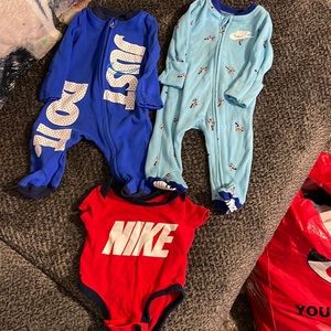 Newborn Nike sleepers and onesie